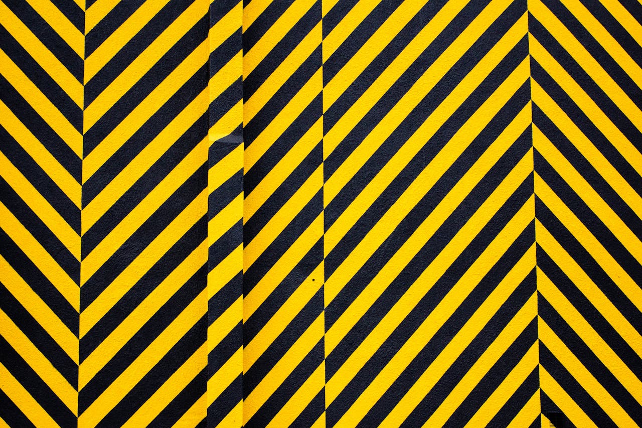 services-04 Dynamic yellow and black patterned background with bold diagonal stripes for creative design use.